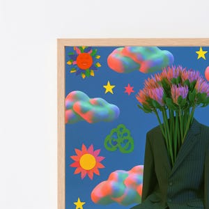 May include: A framed art print featuring a dark blue background with colorful clouds, yellow and red suns, and yellow stars. A dark pinstriped suit jacket is positioned at the bottom right, with a bouquet of pink and green protea flowers emerging from the neck.