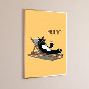May include: A framed wall art print featuring a black and white cat wearing yellow sunglasses, lounging on a light blue deck chair while holding a glass of dark beverage. The background is solid yellow with the text PURRRFECT printed in black.