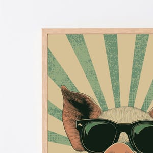 May include: A framed wall art print featuring a stylised illustration of a pig wearing black sunglasses. The background consists of alternating beige and green sunburst rays with a subtle distressed texture. The pig has visible fur detail.