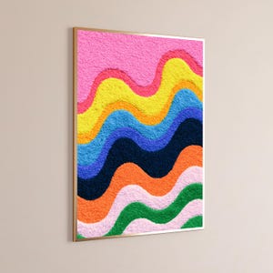 May include: A rectangular wall art piece featuring a textured, tufted surface with horizontal wavy bands of color. The vibrant pattern includes layers of pink, yellow, orange, blue, dark navy, bright orange, light pink, and green in a repeating wave.
