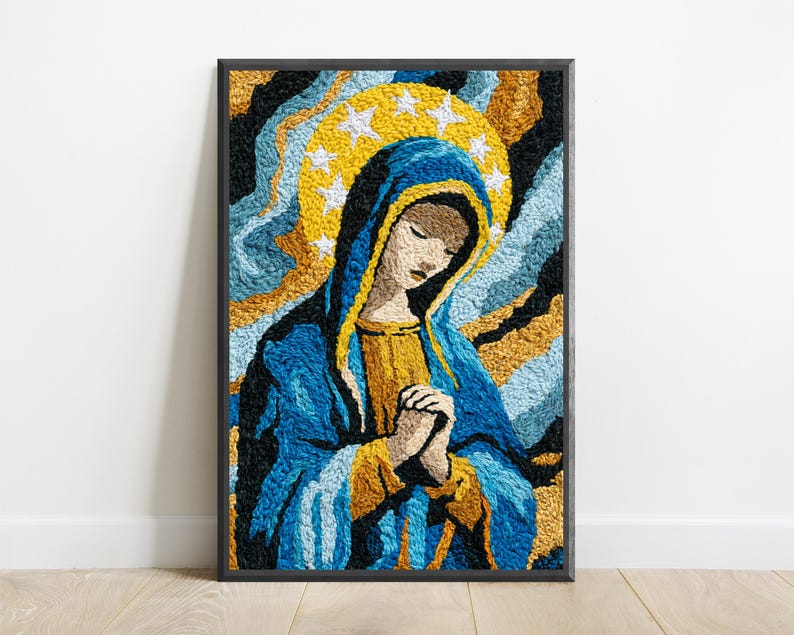May include: A framed textile art piece featuring a textured, embroidered depiction of a figure with hands clasped in prayer. The figure wears a blue and gold head covering and robe, set against a background of swirling black, blue, and gold.