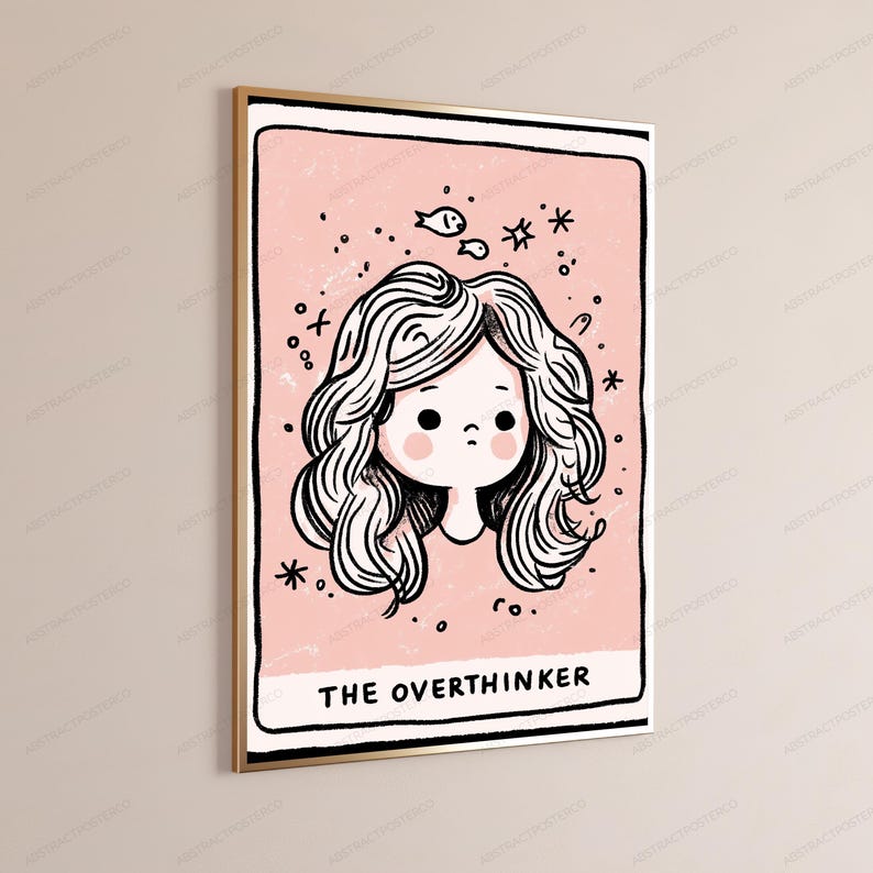 May include: A rectangular wall art print in a gold frame featuring a pink background with a black and white line drawing of a person with wavy hair. The text THE OVERTHINKER is printed at the bottom, surrounded by small star and fish illustrations.