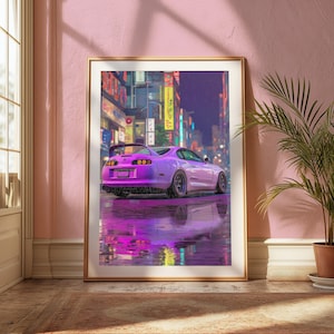 May include: A framed wall art print featuring a purple sports car parked on a wet city street at night. The scene includes vibrant neon signs in the background and a clear reflection of the vehicle on the rain-slicked ground surface.