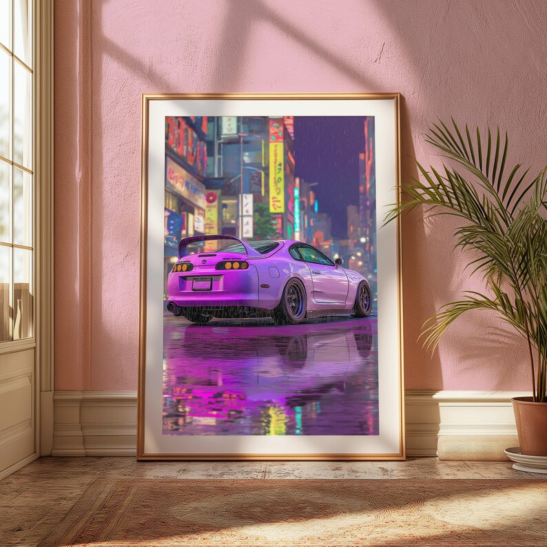 May include: A framed wall art print featuring a purple sports car parked on a wet city street at night. The scene includes vibrant neon signs in the background and a clear reflection of the vehicle on the rain-slicked ground surface.