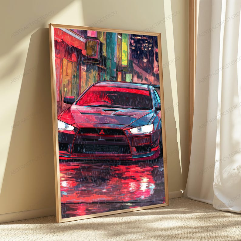 May include: A vertical framed art print featuring a stylized illustration of a red Mitsubishi Lancer Evolution sports car parked on a wet street at night. The scene depicts heavy rain with vibrant red reflections on the ground and city lights.