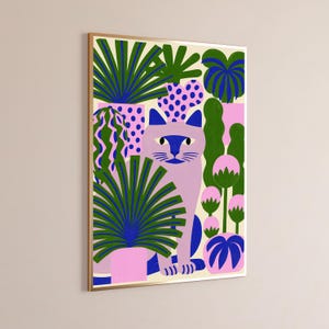 May include: A framed rectangular wall art print featuring a light purple cat sitting among various potted plants. The plants have green and blue leaves, and the pots are pink with blue polka dots or solid pink. The background is a cream color.