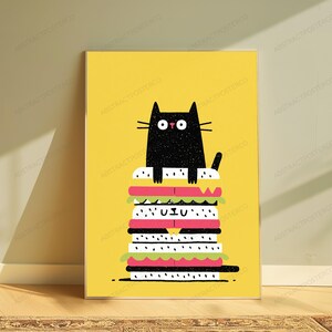 May include: A vertical rectangular art print on a bright yellow background featuring a black cat with wide eyes sitting atop a tall, multi-layered sandwich. The sandwich consists of white bread slices with black speckles, pink meat, and green lettuce layers.