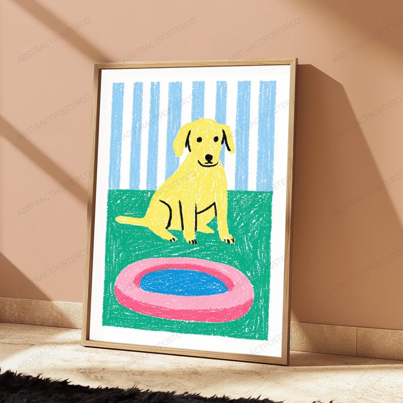 May include: A framed wall art print featuring a yellow dog sitting on a green surface in front of a blue and white striped background. In the foreground, there is a pink circular object with a blue center, rendered in a crayon-like texture.