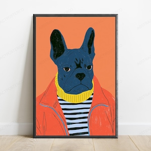 May include: A framed wall art print featuring a stylized illustration of a dark blue French bulldog wearing a yellow turtleneck sweater under a bright orange jacket, set against a solid orange background with a black frame border.