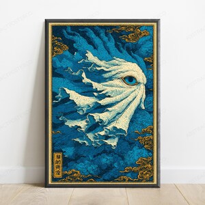 May include: A rectangular wall art print featuring a stylized white, flowing, ghost-like figure with a single prominent blue eye, set against a deep blue background with gold-colored clouds and a small vertical rectangular box containing black text.