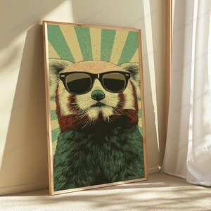 May include: A rectangular wall art print featuring a stylized illustration of a red panda wearing black sunglasses. The background consists of a vintage-inspired sunburst pattern in alternating shades of muted green and light beige.