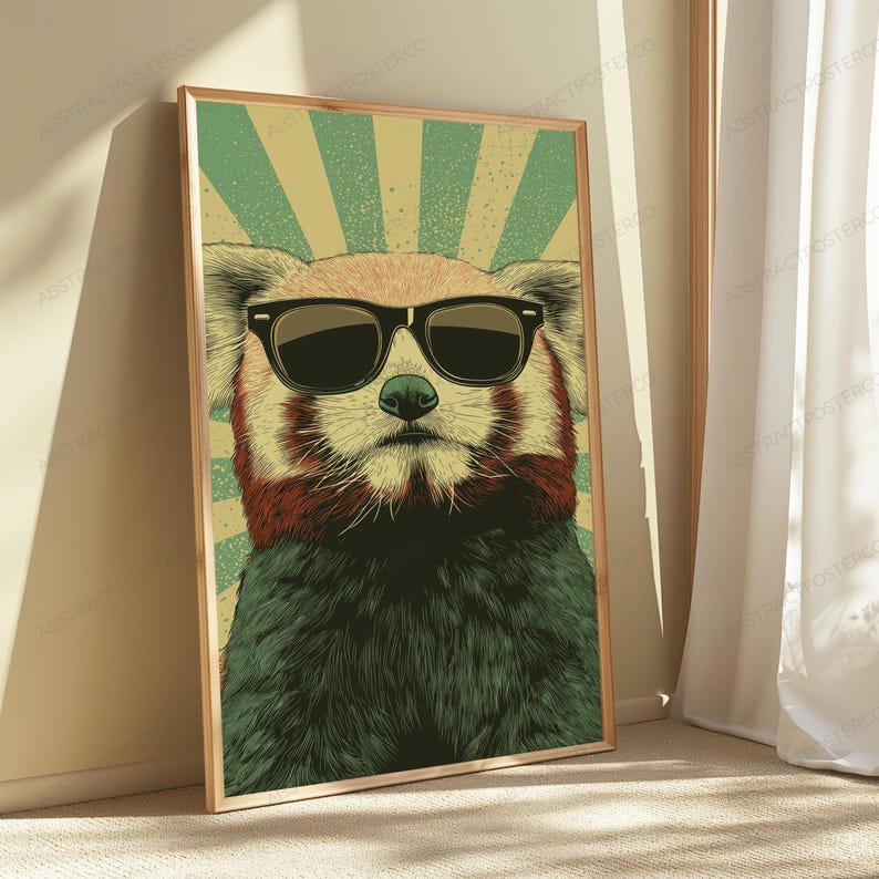May include: A rectangular wall art print featuring a stylized illustration of a red panda wearing black sunglasses. The background consists of a vintage-inspired sunburst pattern in alternating shades of muted green and light beige.