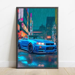 May include: A framed vertical art print featuring a bright blue sports car parked on a wet city street at night. The scene is set in a rainy urban environment with glowing neon signs in the background, reflecting on the dark, rain-slicked pavement.