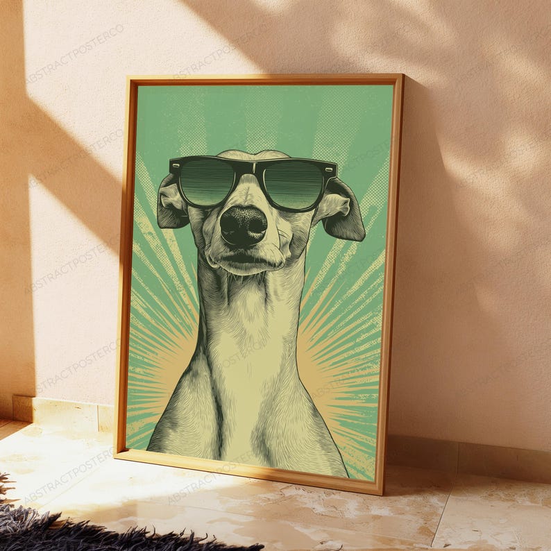 May include: A framed poster featuring a stylized illustration of a greyhound dog wearing black sunglasses. The dog is centered against a green background with a radiating sunburst pattern. The artwork uses a halftone dot texture throughout.