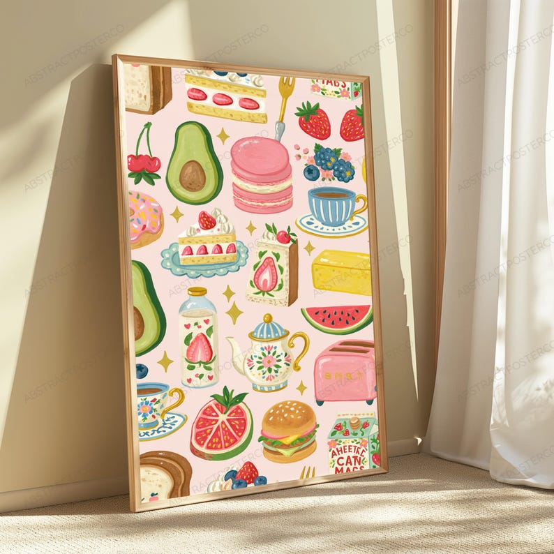 May include: A rectangular wall art print featuring a light pink background with a repeating pattern of food items including strawberries, avocado halves, pink macarons, slices of cake, a teapot, a pink toaster, a burger, and a carton of strawberry milk.