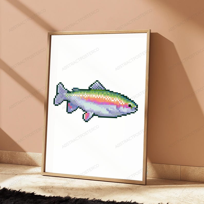 May include: A framed wall art print featuring a pixel art illustration of a rainbow trout. The fish is rendered in a digital style with a white background, showcasing a gradient of pink, green, and blue scales along its body and fins.