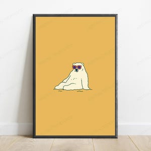 May include: A framed wall art print featuring a white polar bear sitting down and wearing red-rimmed sunglasses against a solid mustard yellow background. The illustration uses clean black outlines to define the bear's form and facial features.