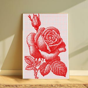 Pode incluir: Uma impress&atilde;o de arte de parede retangular com uma ilustra&ccedil;&atilde;o de uma rosa vermelha composta por um padr&atilde;o denso de pontos. O design inclui uma rosa em flor, um bot&atilde;o e folhas sobre um fundo branco, emoldurado por uma moldura de madeira clara.