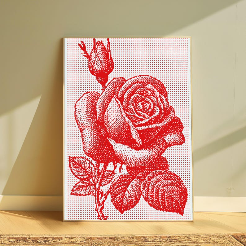 Pode incluir: Uma impress&atilde;o de arte de parede retangular com uma ilustra&ccedil;&atilde;o de uma rosa vermelha composta por um padr&atilde;o denso de pontos. O design inclui uma rosa em flor, um bot&atilde;o e folhas sobre um fundo branco, emoldurado por uma moldura de madeira clara.