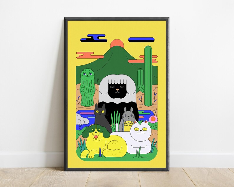 May include: A framed art print featuring a yellow background with a green mountain, a red sun, and blue clouds. The scene includes a black and white sheep, a black cat, a grey creature, a yellow dog, and a white cat, alongside cacti and plants.