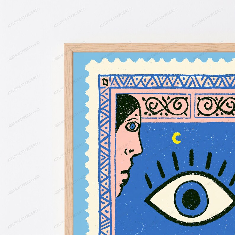 May include: A framed wall art print featuring a postage stamp design with a light blue border. The illustration shows a profile of a face in pink, a large blue eye, and a yellow crescent moon against a blue background with decorative patterns.