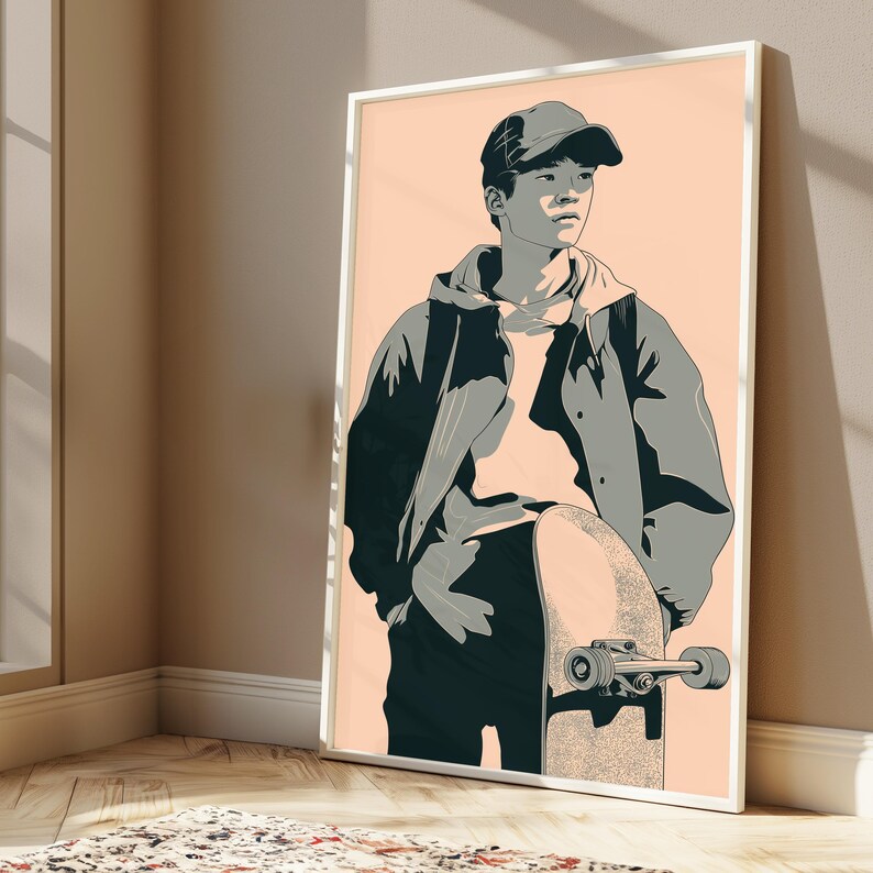 May include: A framed wall art print featuring a stylized illustration of a person wearing a baseball cap, a hooded sweatshirt, and a jacket, standing while holding a skateboard. The artwork uses a palette of peach, dark gray, and light gray tones.