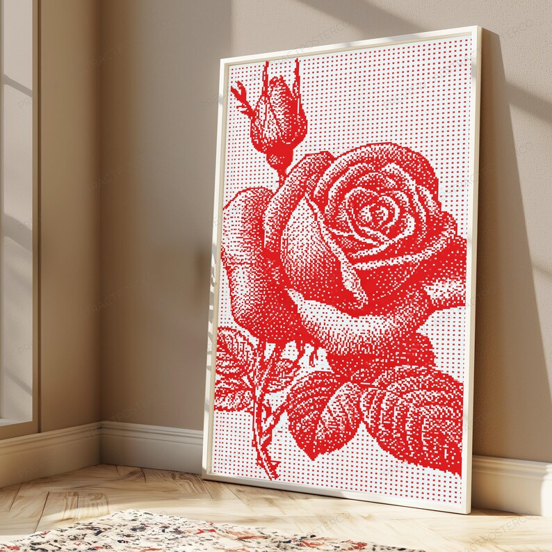 Pode incluir: Uma impress&atilde;o de arte de parede retangular emoldurada apresentando uma rosa vermelha e um bot&atilde;o de rosa sobre um fundo branco. O design usa um padr&atilde;o de pontos para criar a imagem da flor, folhas e caule em vermelho vibrante sobre fundo branco.