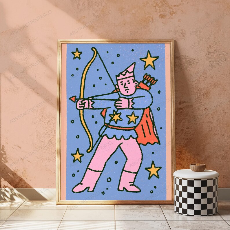 May include: A framed art print featuring a stylized illustration of a figure in a pointed hat, blue tunic with yellow stars, and pink pants, holding a yellow bow and arrow against a blue background filled with yellow stars and small dots.