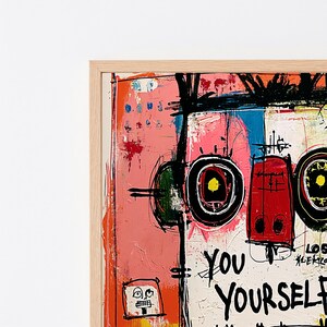 May include: A framed abstract painting featuring bold black brushstrokes, vibrant pink, red, and blue color blocks, and stylized circular motifs. The artwork includes the text "YOU YOURSELF" written in a prominent, hand-drawn black typeface.
