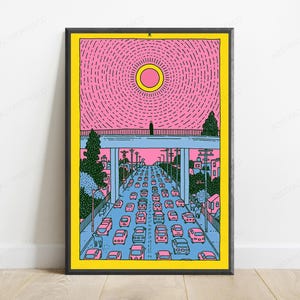 May include: A framed art print featuring a stylized illustration of a highway filled with pink cars under a bridge. A lone figure stands on the bridge beneath a large yellow sun against a pink sky. The scene includes green trees and utility poles.