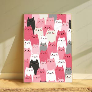 May include: A vertical rectangular wall art print featuring a dense, repeating pattern of stylized cats in shades of pink, white, black, and gray. The cats have simple facial features, including eyes, noses, and mouths, with some winking or smiling.