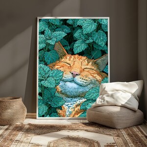 May include: A rectangular wall art print featuring a vibrant illustration of an orange tabby cat with closed eyes, resting amidst a dense cluster of textured, teal-green leaves. The cat has a light-colored muzzle and a pink nose, surrounded by foliage.
