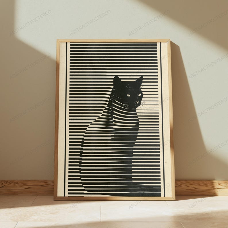 May include: A framed rectangular wall art print featuring a black silhouette of a cat sitting in profile. The cat is overlaid with horizontal black and cream-colored stripes that create a visual effect of light filtering through window blinds.
