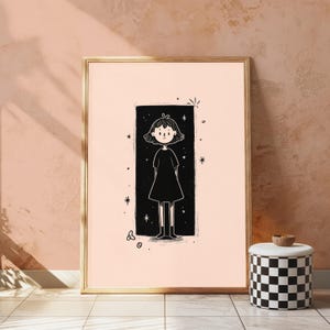 May include: A framed wall art print featuring a black and white line drawing of a person with short hair wearing a dress, centred within a solid black rectangular background surrounded by small star and circular shapes on a light peach background.