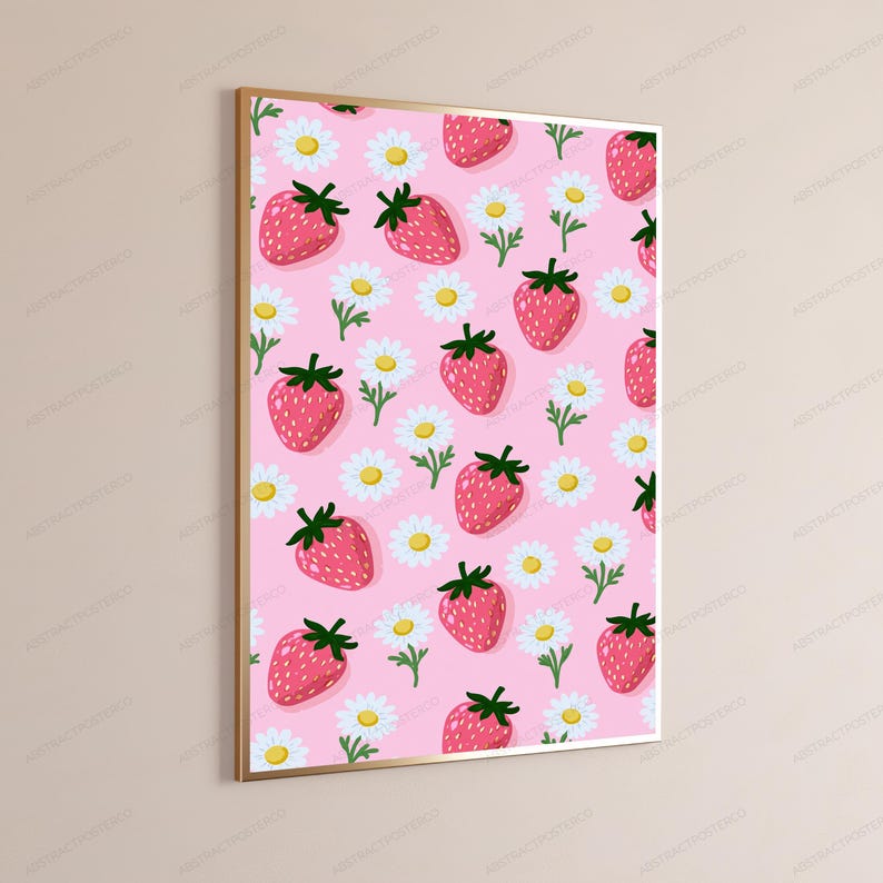 May include: A rectangular wall art print featuring a repeating pattern of pink strawberries with green stems and white daisies with yellow centers on a light pink background, enclosed within a thin metallic gold frame.