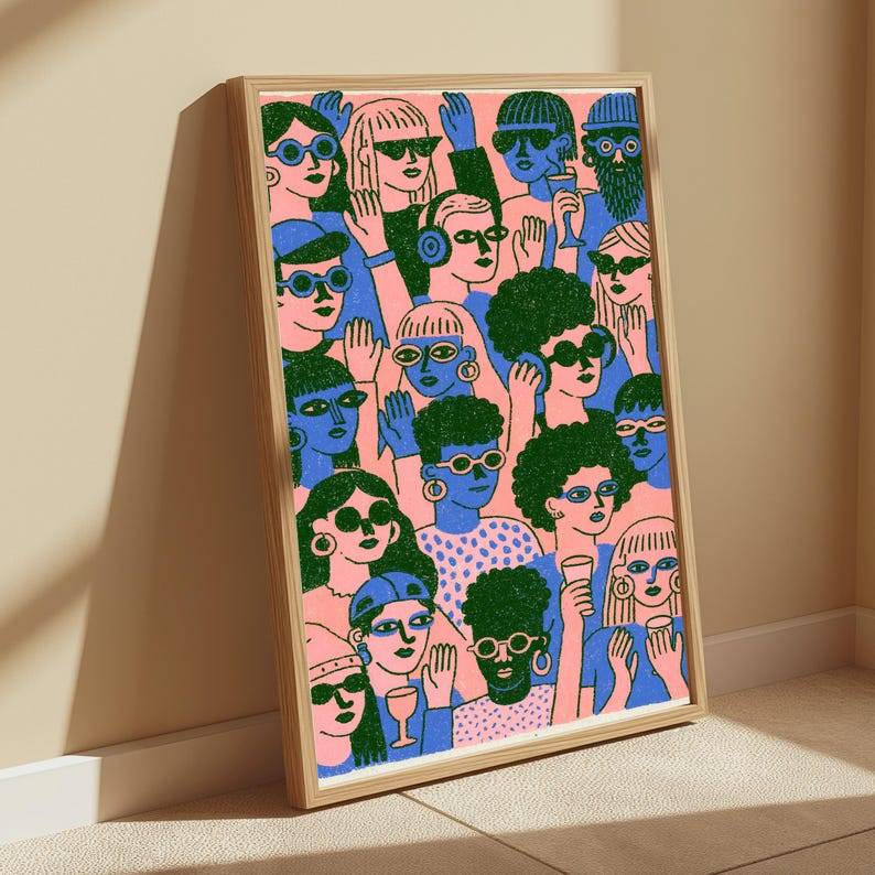 May include: A framed rectangular art print featuring a dense crowd of people illustrated in a flat graphic style. The figures are rendered in shades of pink, blue, and dark green, with many wearing sunglasses, hats, and holding drinking glasses.