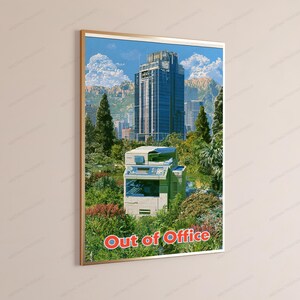 May include: A framed vertical poster featuring a light-colored office printer situated in a lush green garden with trees and shrubs. In the background, a tall blue skyscraper stands under a blue sky with clouds. The text Out of Office is in red.