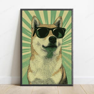 May include: A framed wall art print featuring a stylized illustration of a Shiba Inu dog wearing black sunglasses. The dog is centered against a background of radiating light green and cream-colored sunburst lines, creating a bold graphic effect.