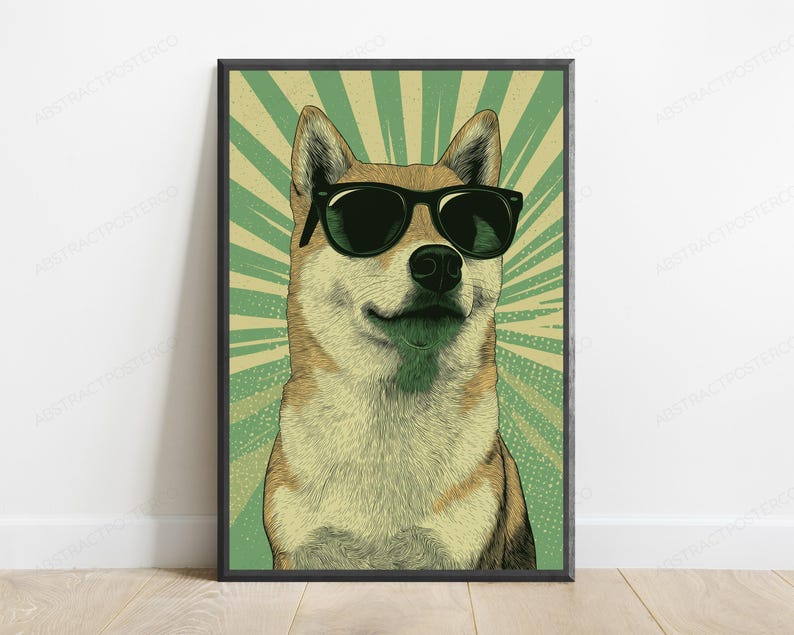 May include: A framed wall art print featuring a stylized illustration of a Shiba Inu dog wearing black sunglasses. The dog is centered against a background of radiating light green and cream-colored sunburst lines, creating a bold graphic effect.