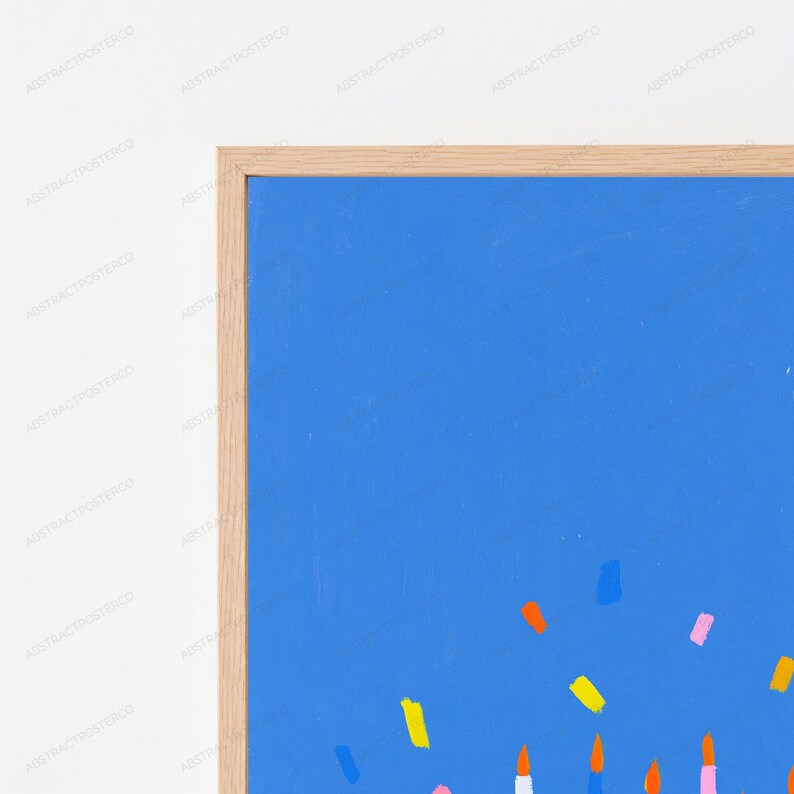 May include: A rectangular wall art print featuring a vibrant blue background with scattered, small, multi-colored confetti-like brushstrokes in yellow, orange, pink, and light blue, encased in a light-toned natural wood frame.