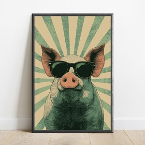 May include: A framed wall art print featuring a stylised illustration of a pig wearing black sunglasses. The pig is centred against a background of radiating light green and beige sunburst rays with a subtle dotted texture throughout the design.