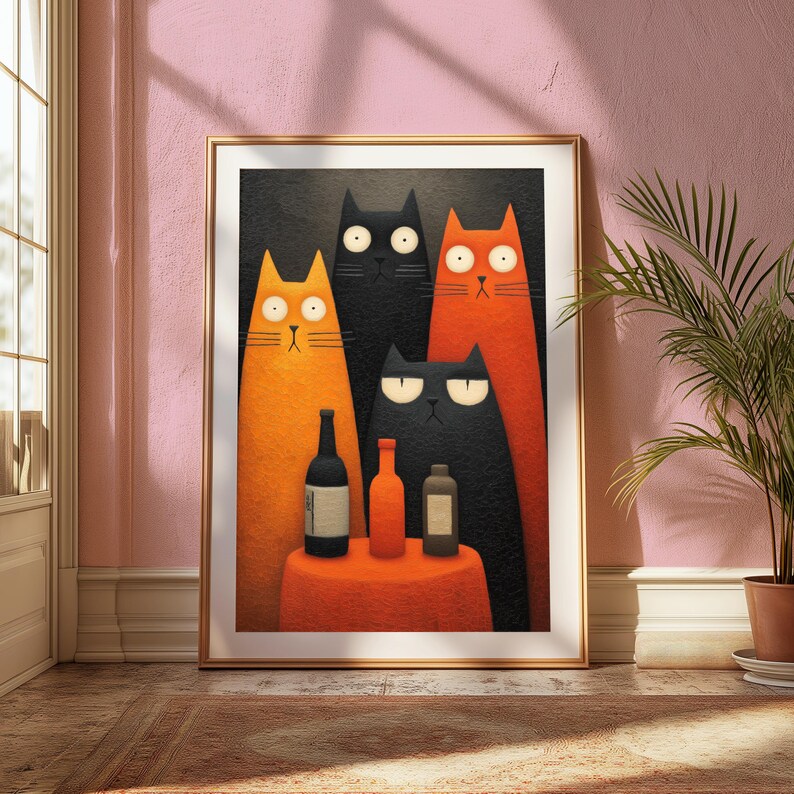 May include: A framed art print featuring a whimsical illustration of four stylized cats. Two orange cats and two black cats stand together, with bottles on a small orange table. The artwork is set against a dark background.
