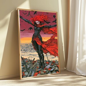 May include: A framed wall art print depicting a figure with long red hair wearing black armour and a flowing red cape. The figure stands amidst a field of debris under a sunset sky filled with black birds, rendered in a vibrant illustrative style.