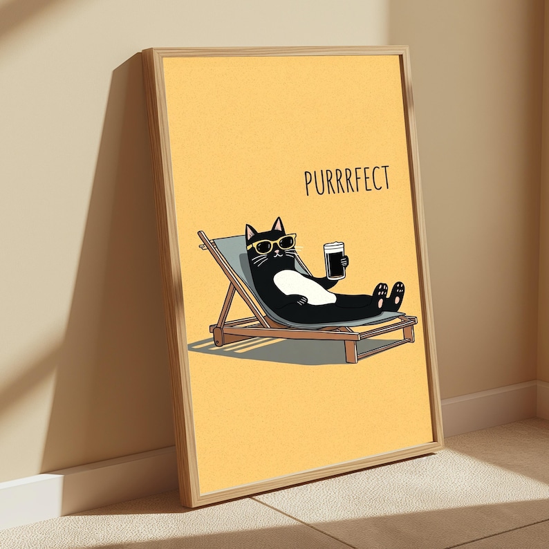 May include: A framed wall art print featuring a black and white cat wearing yellow sunglasses, relaxing on a light blue lounge chair while holding a dark beverage. The background is solid yellow with the text PURRRFECT printed in black.