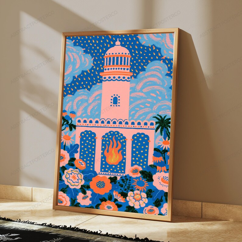 May include: A framed vertical art print featuring a central pink tower structure with a flame motif in the lower archway. The scene is surrounded by stylized blue and orange flowers, set against a dark blue background with light blue clouds.