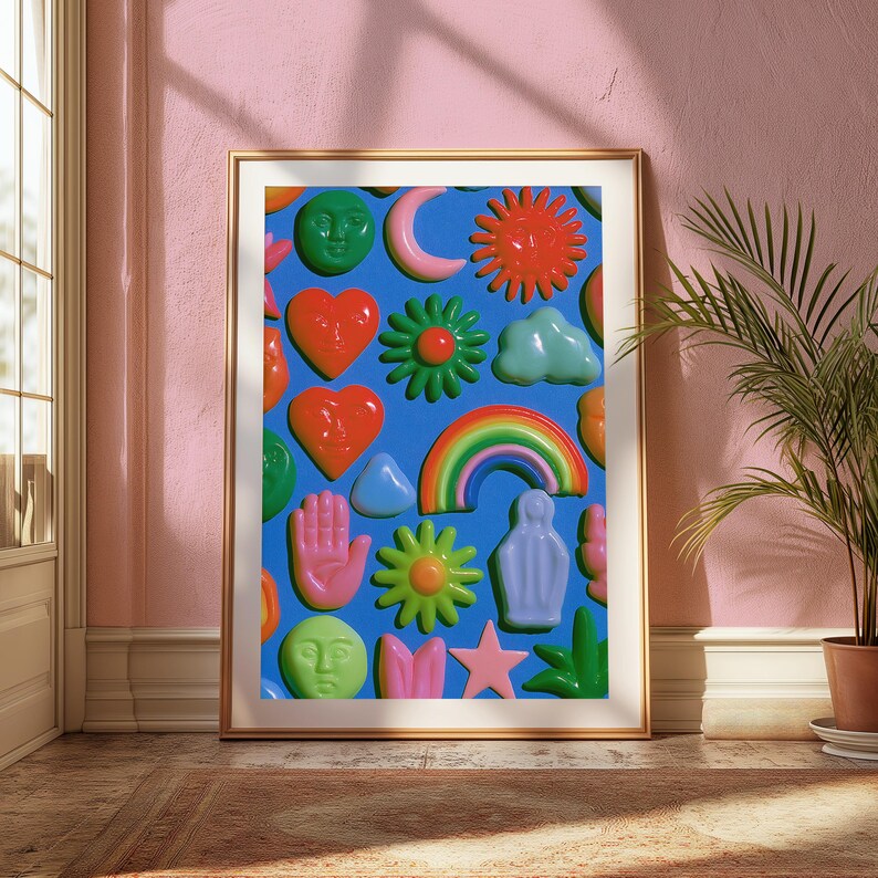May include: A framed wall art print featuring a vibrant blue background covered in glossy, three-dimensional style icons including a green moon face, red sun, orange hearts, rainbow, pink hand, green flowers, blue cloud, and a pink star.
