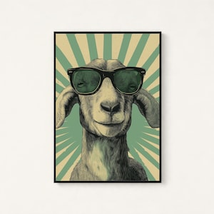 May include: A rectangular wall art print featuring a detailed illustration of a goat wearing black-rimmed sunglasses. The background consists of a vintage-style sunburst pattern in muted green and beige tones, framed by a thin black border.