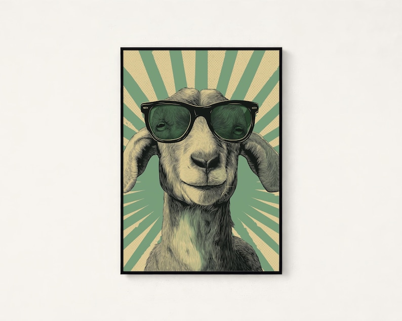 May include: A rectangular wall art print featuring a detailed illustration of a goat wearing black-rimmed sunglasses. The background consists of a vintage-style sunburst pattern in muted green and beige tones, framed by a thin black border.