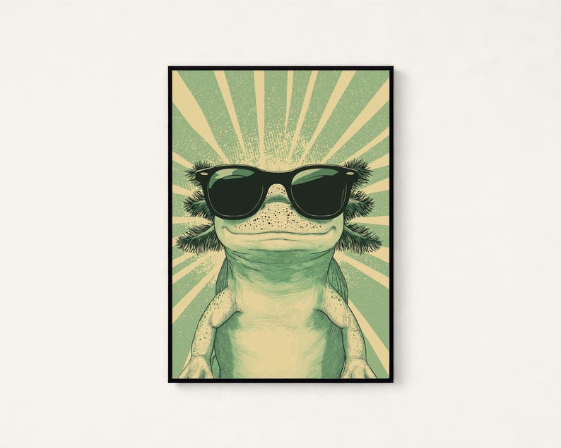 Puede incluir: Una impresi&oacute;n de arte mural enmarcada que presenta un ajolote verde claro con gafas de sol negras. El ajolote est&aacute; centrado sobre un fondo de rayos de sol radiantes en verde claro y crema, creando un estilo de ilustraci&oacute;n gr&aacute;fica.