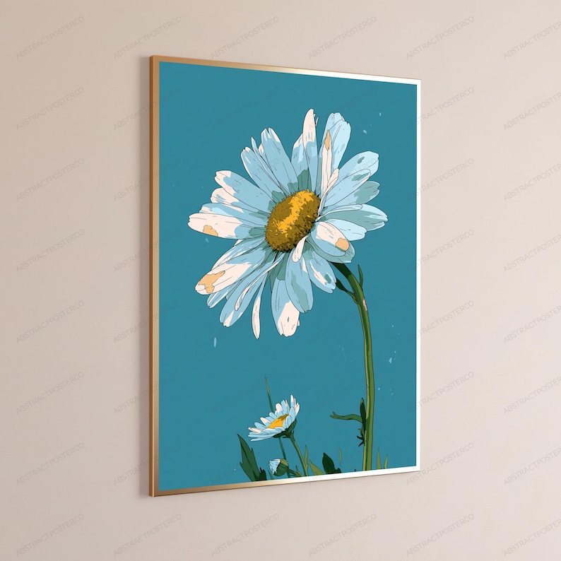 May include: A rectangular wall art print in a thin gold frame featuring a stylized illustration of a large white daisy with a textured yellow center and a smaller daisy below, set against a solid teal blue background with subtle white specks.